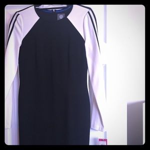 Black dress with white stripe trim.